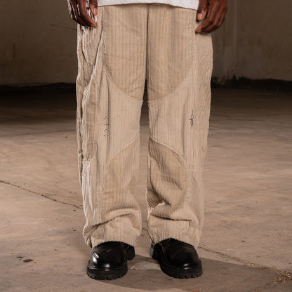 CALÇA ELO EM COMUM  BRAILLE BEGE