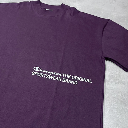CAMISETA CHAMPION MAKE A CHAMPION PURPLE